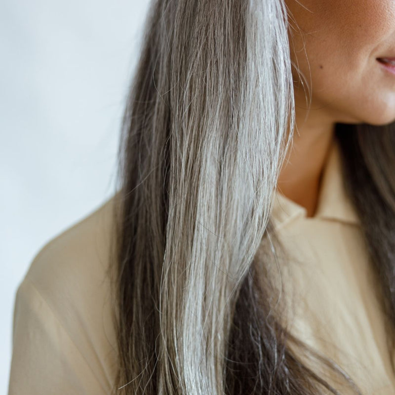 Female with natural grey straight smooth hair